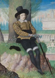 Junger Mann unter einem Baum sitzend